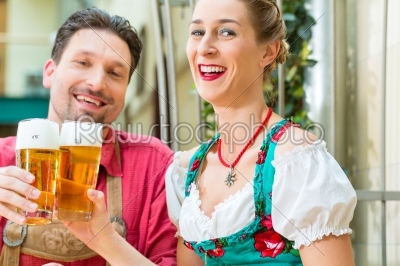 Young couple in Bavaria in restaurant or pub