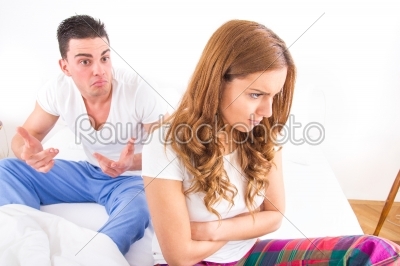 Young couple sitting on the bed because of Relationship Difficul
