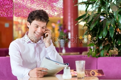 Young man in ice cream parlor