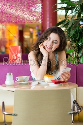 Young woman in ice cream parlor