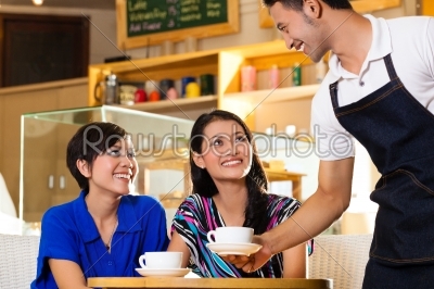 Young women in an Asian coffeeshop