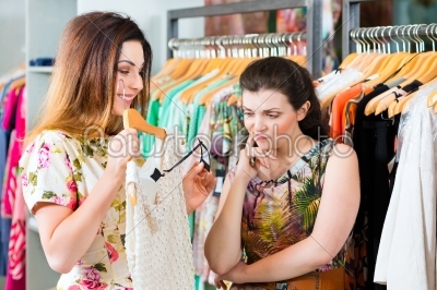 Young women shopping in fashion department store