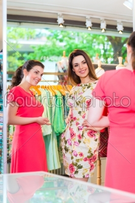 Young women shopping in fashion department store